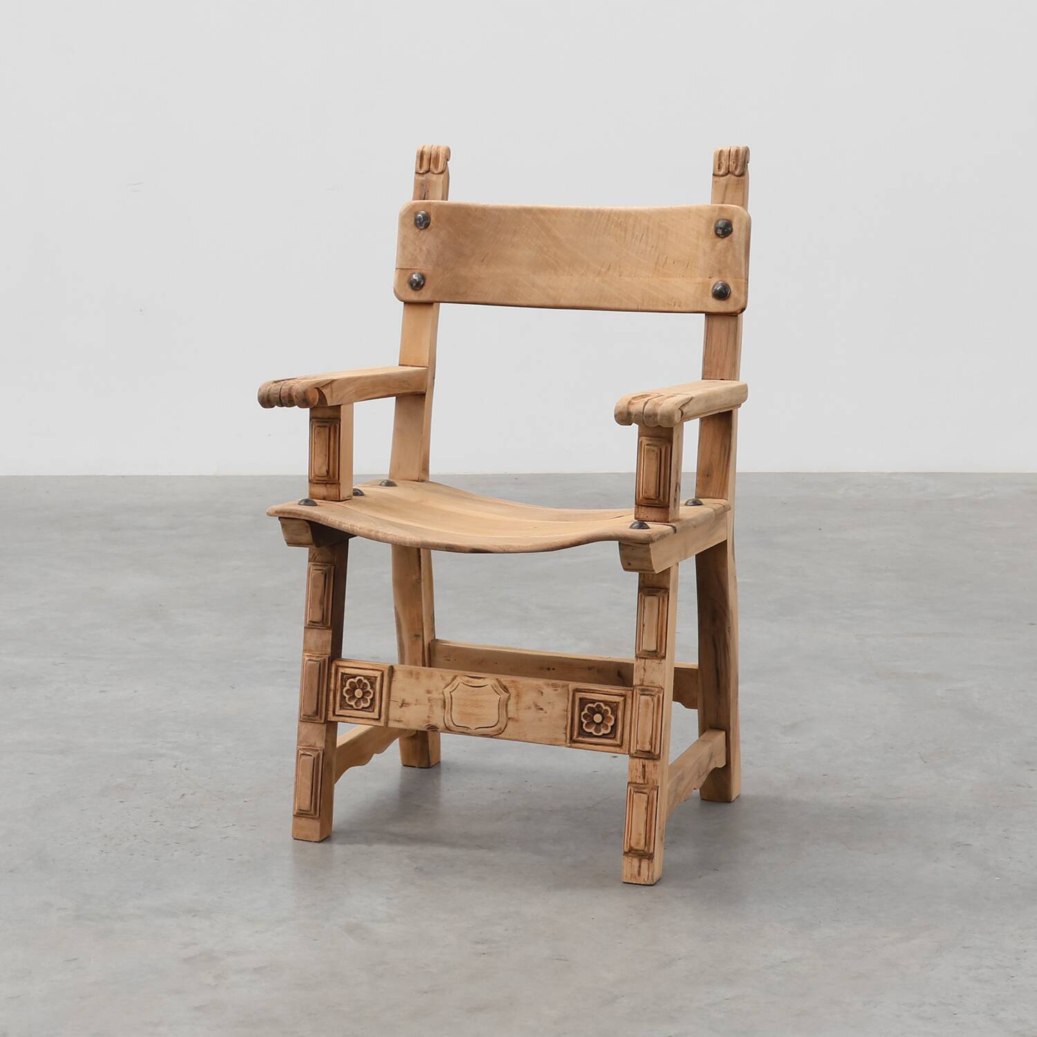 Brutalist armchair with carved rosettes and nailed wooden seat, Spain, 20th