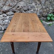 Vintage pine table with drop-leaf extension and turned beech legs, France, 1930s.