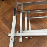 70s design coffee table in rectangular glass with chrome legs.