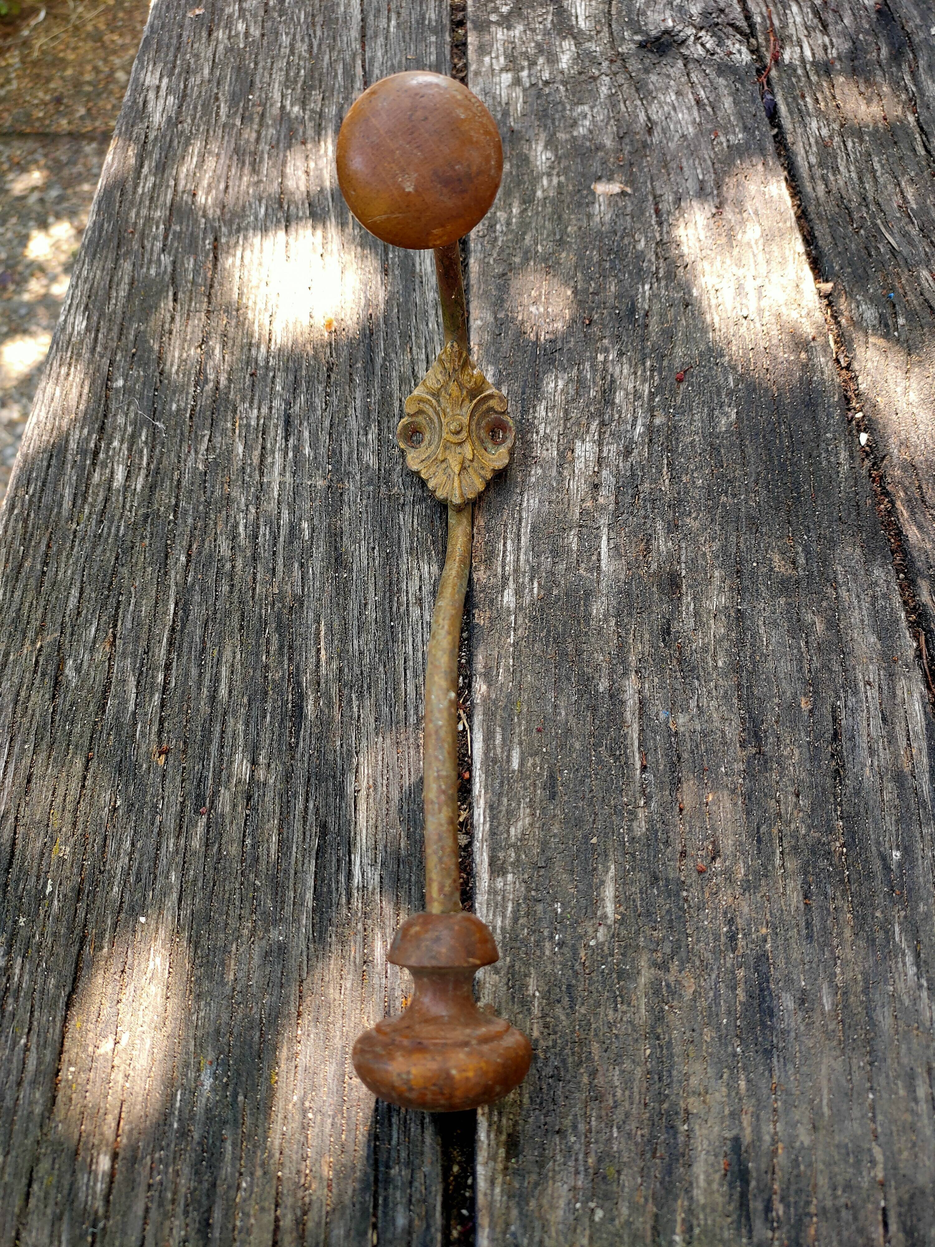 Wooden and metal wall coat rack.