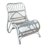 Vintage arched rattan armchair. 1970s.
