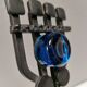 Vintage wall candle holder in wrought iron and hard pressed blue glass.
