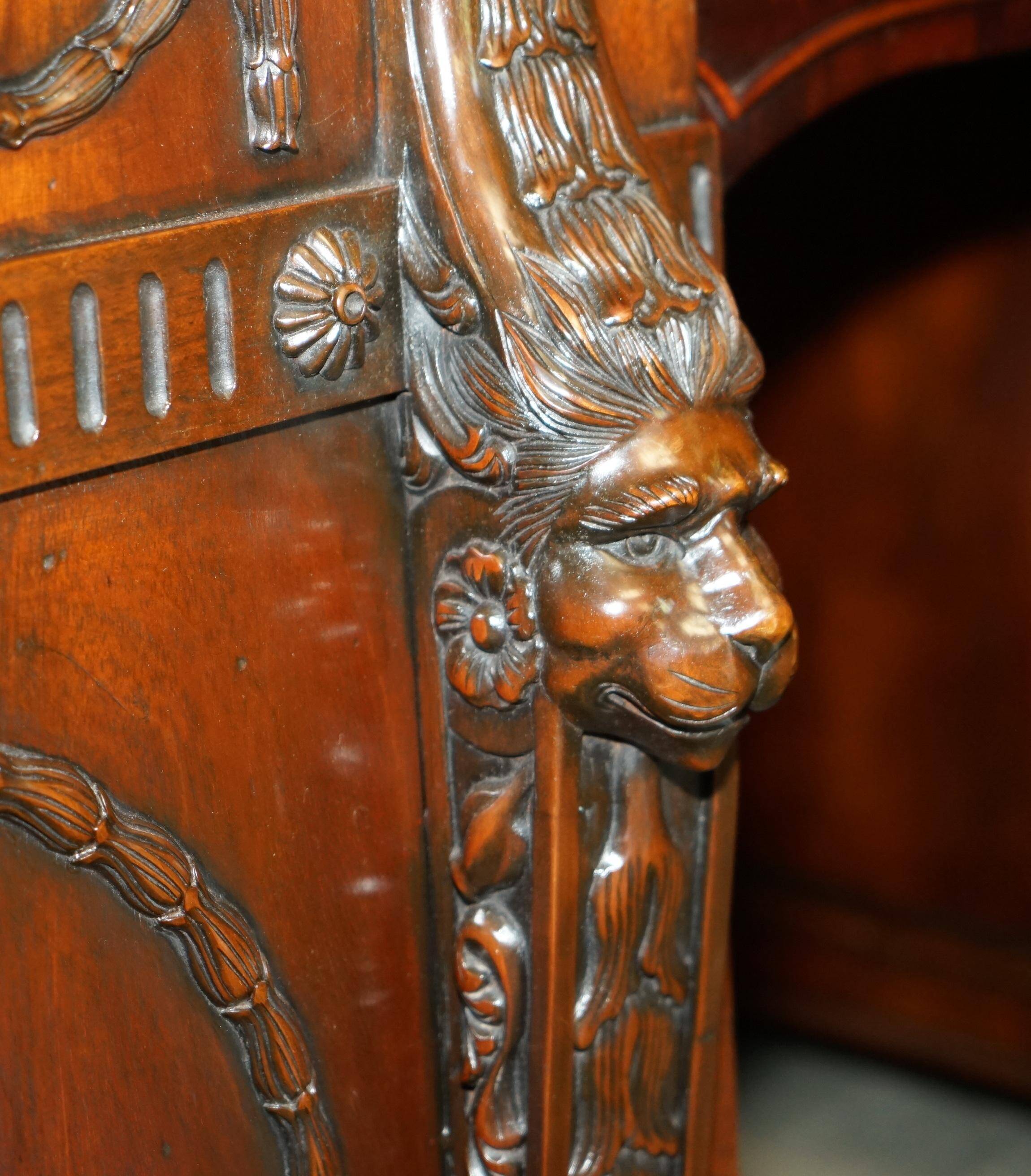 Partner desk with two carved columns featuring lion heads, according to Thomas Chippendale, restored.