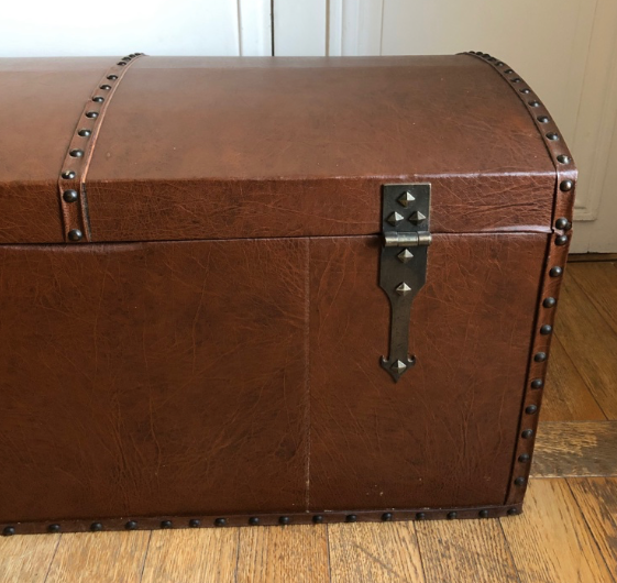 Ancient wooden and faux leather trunk