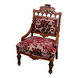 Antique lacquered wooden armchair with burgundy fabric, carved, before 1890.
