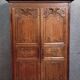 Louis XIV period wardrobe in solid oak, decorated with superb carvings
