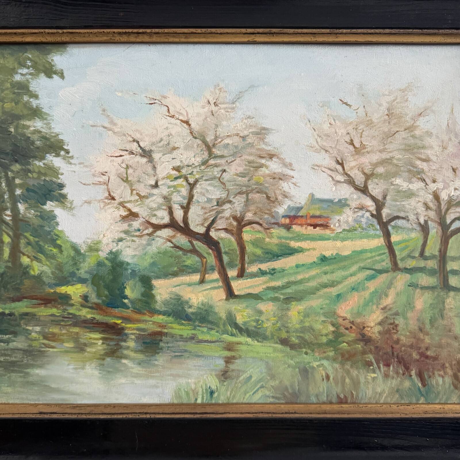 Oil on panel 20th century watercourse trees in bloom blackened wooden frame