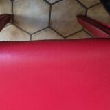 Red leather dining chairs by Arper