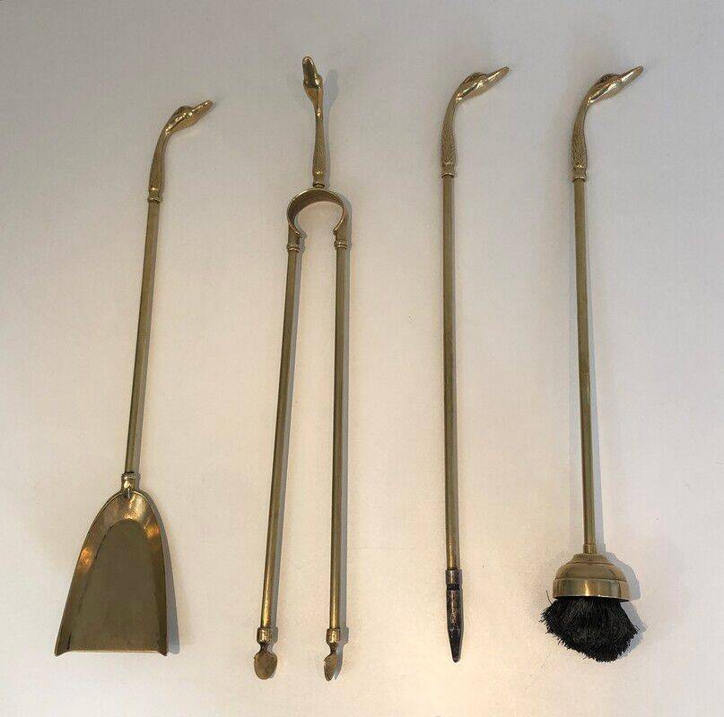 Fire necessary for the brass duck heads in the style of Maison Jansen.