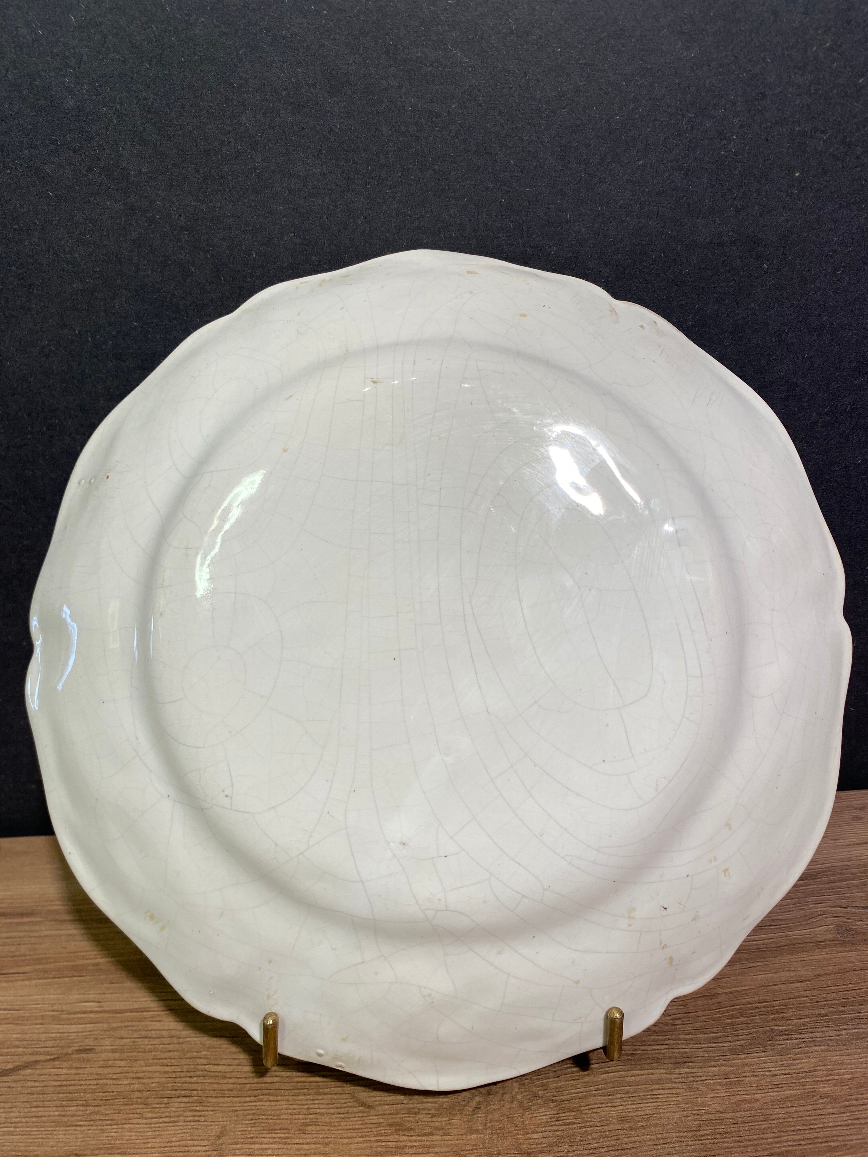 Earthenware plate decorated with winged character decoration in Nevers style, Auxerrois