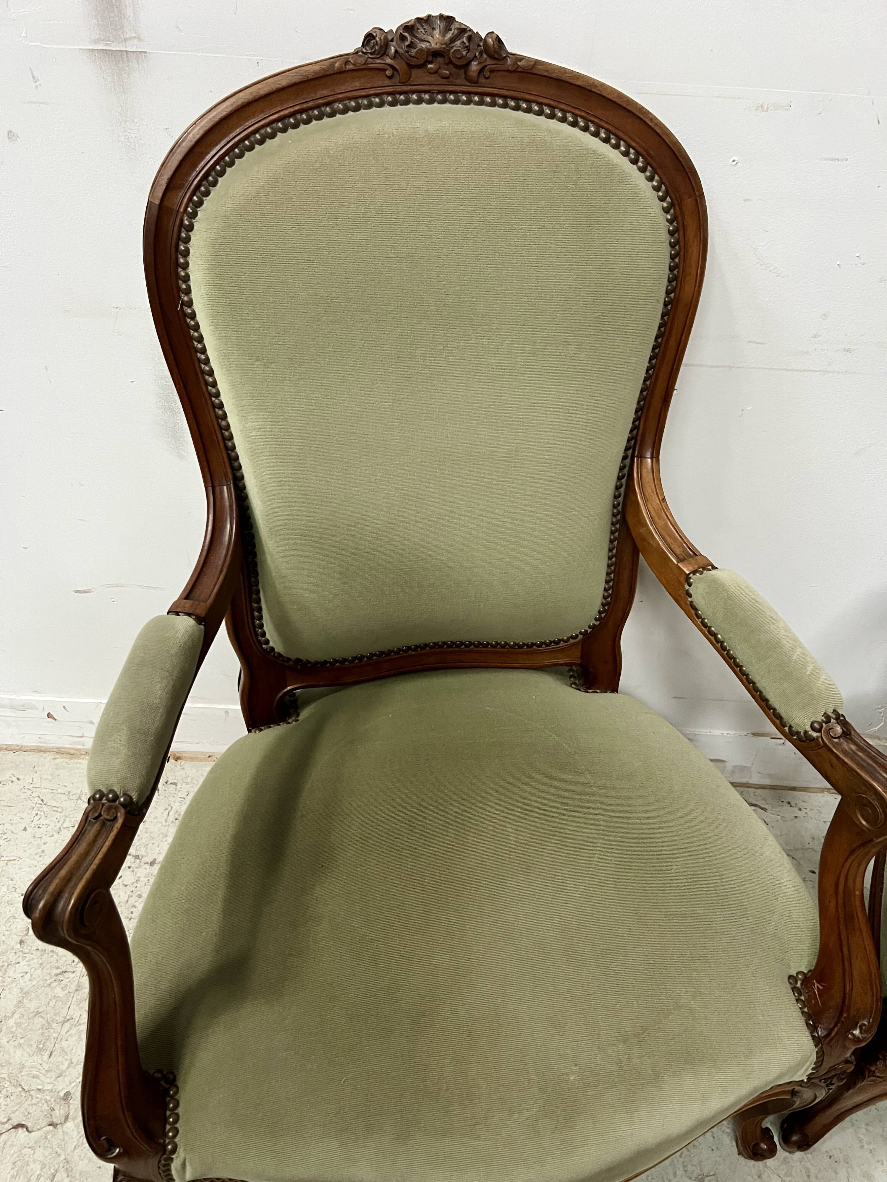 Pair of Louis XV style armchairs in solid walnut, 20th century.