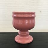 Pink flowerpot on stand