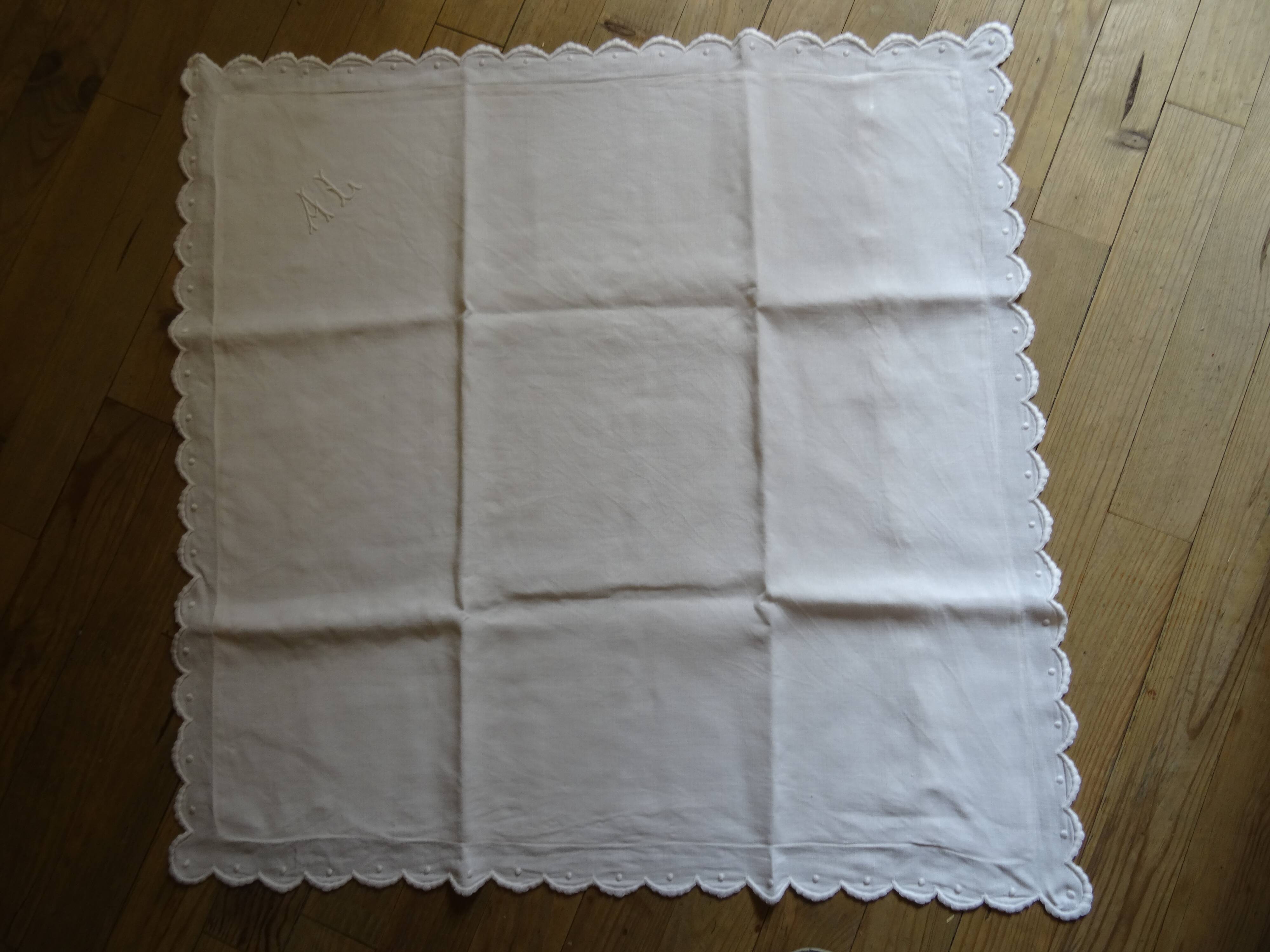 Pair of AL monogrammed pillowcases