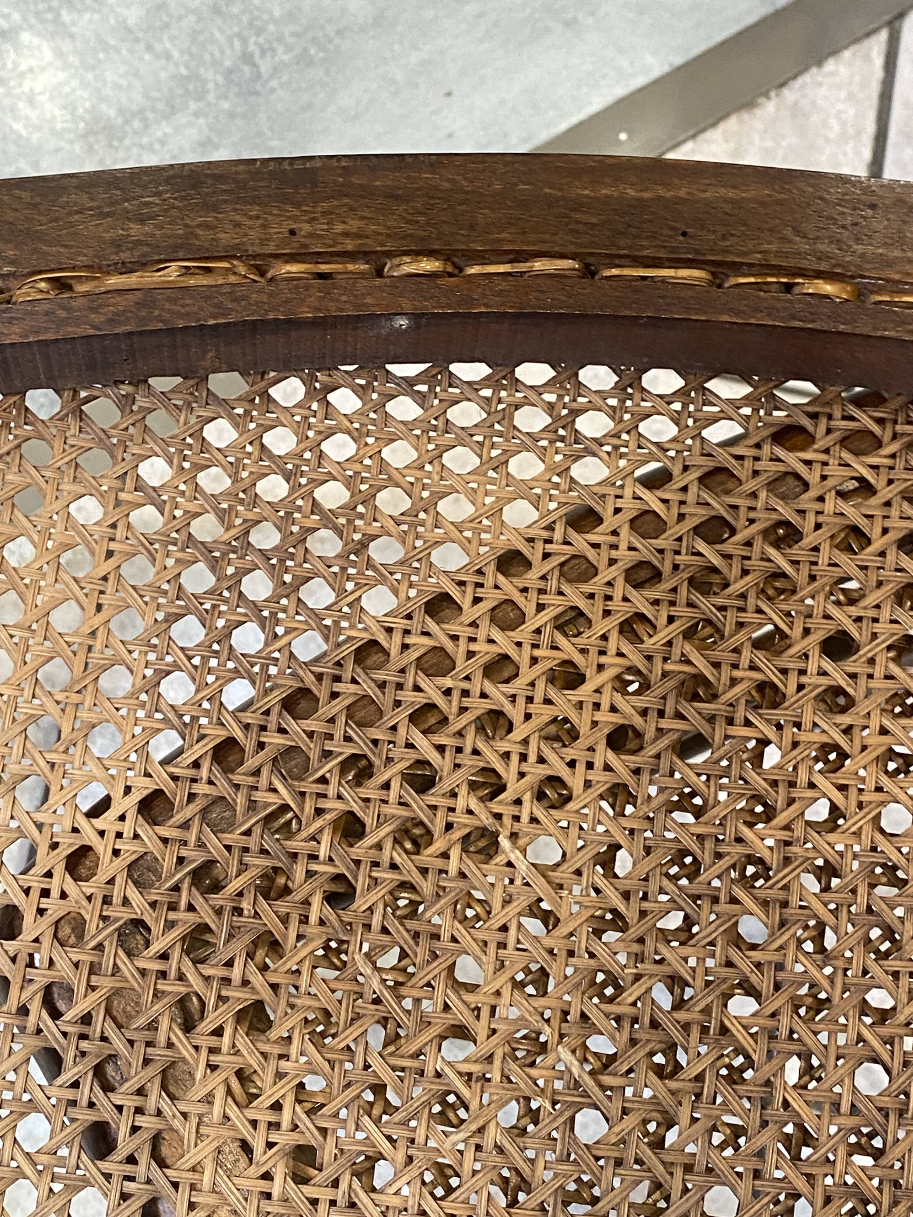 Pair of N2 antique caned and wooden chairs from the 1900s.