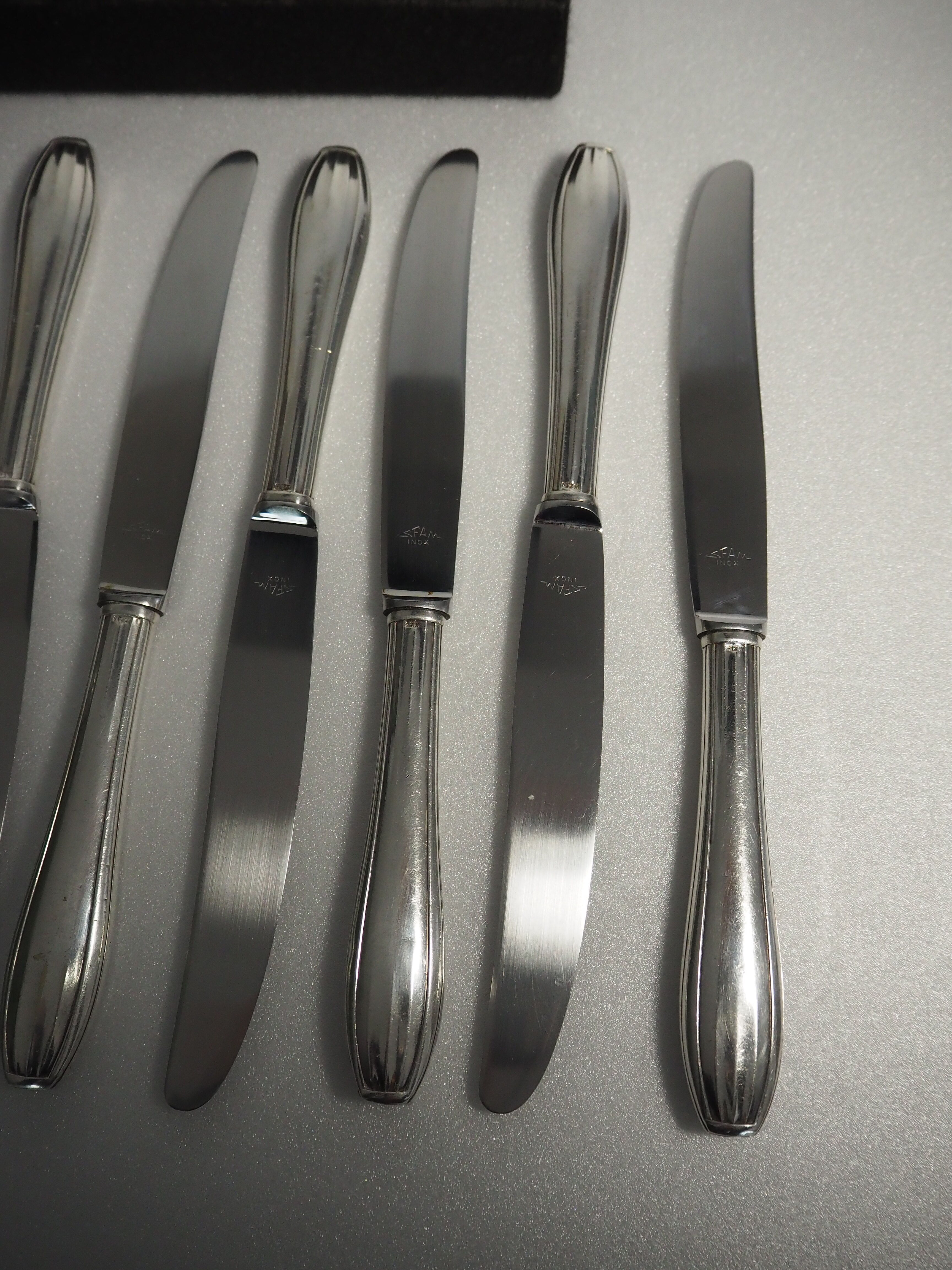 12 SFAM cheese knives in its dark chocolate case