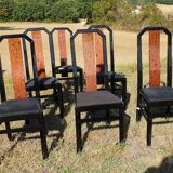 Octagonal table paul michel and its black lacquered chairs and elm magnifying glass