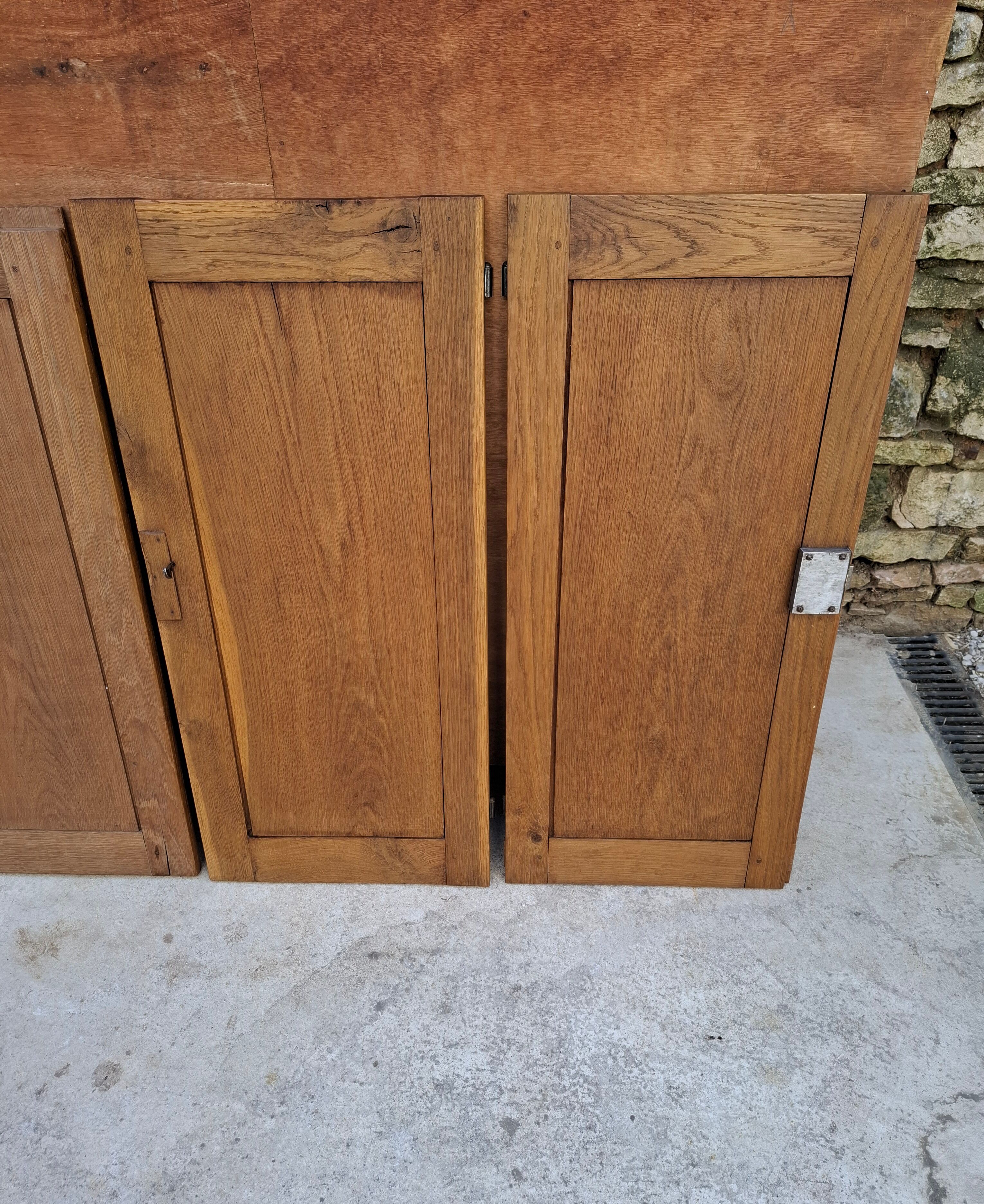 Oak workshop furniture with sliding doors.
