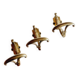 Trio of brass coat hooks or coat racks