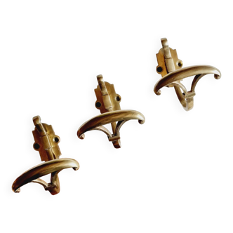 Trio of brass coat hooks or coat racks