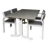 Dining table set and 4 dining chairs by Pierre Mennen for Pastoe.