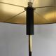Designer floor lamp in black lacquered metal and brass