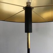 Designer floor lamp in black lacquered metal and brass