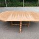 Round extendable farmhouse dining table, stripped, Louis XIII style from the 1960s.
