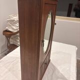 Wall cabinet with oval wall and drawer