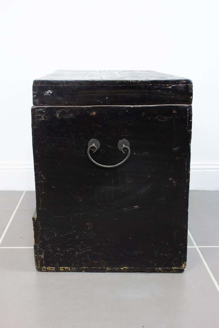 Brown and gold lacquered Chinese chest decorated with flowers circa 1900