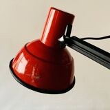 Old articulated desk lamp in red metal