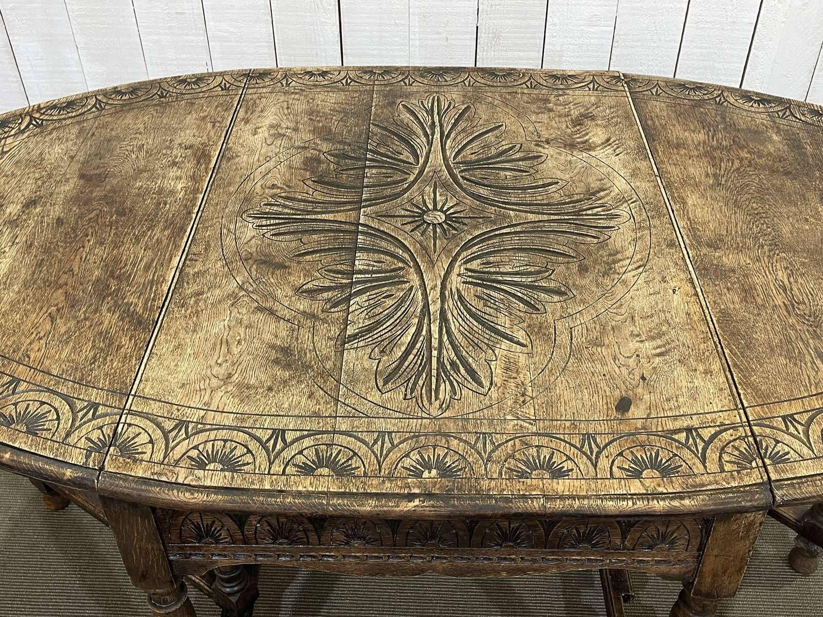 English oak drop-leaf table from the early 20th century