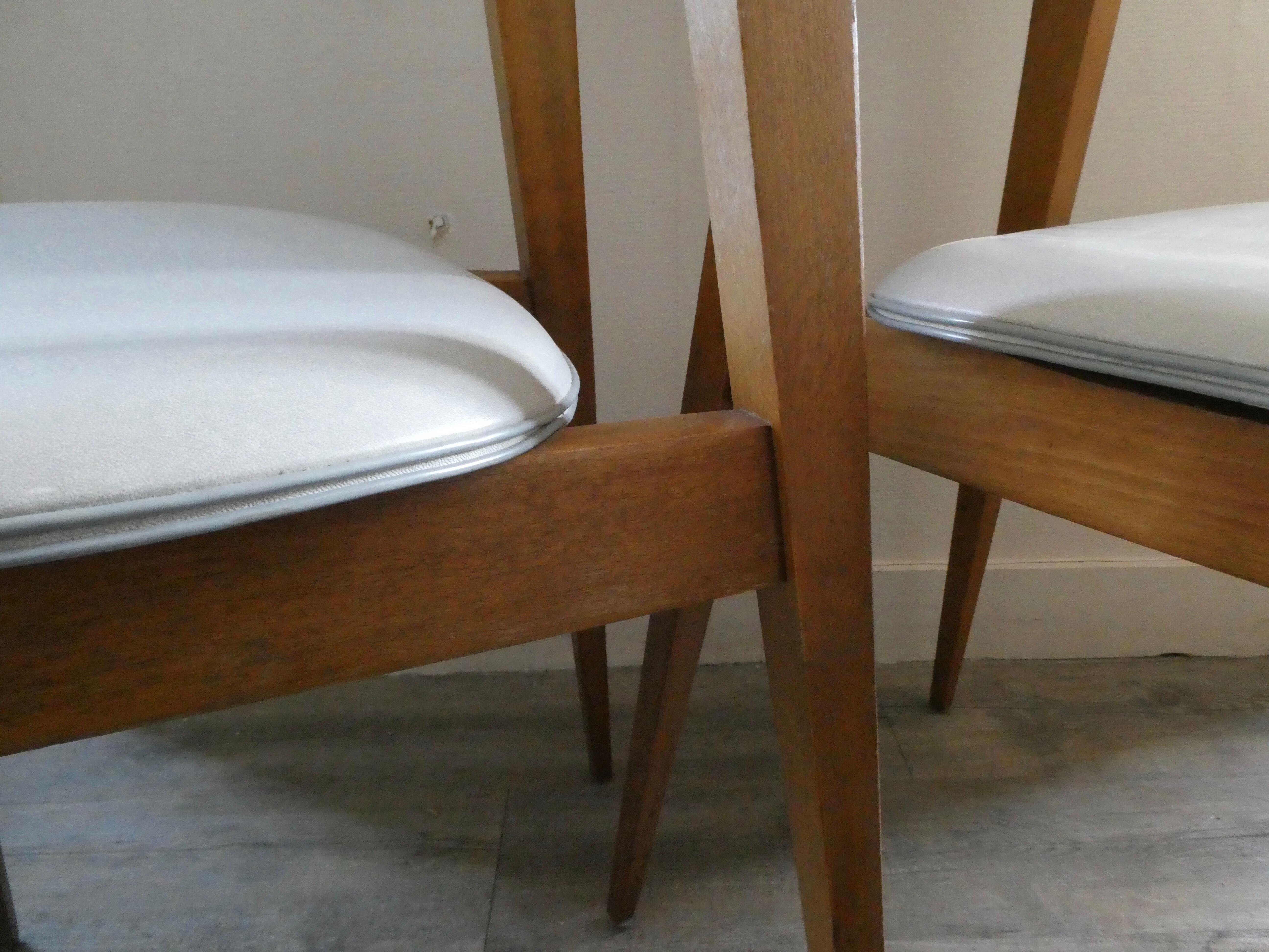 Pair of wooden chairs and skai scandinavian style