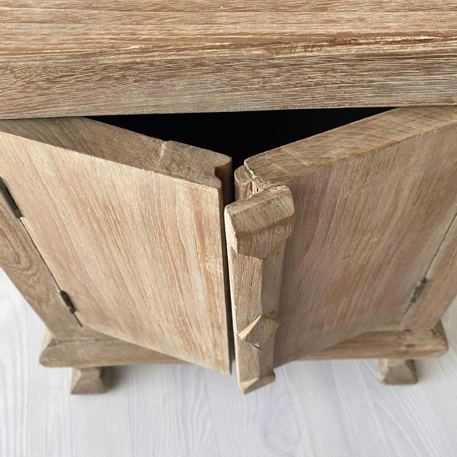 Balinese bedside table in solid carved and limed wood