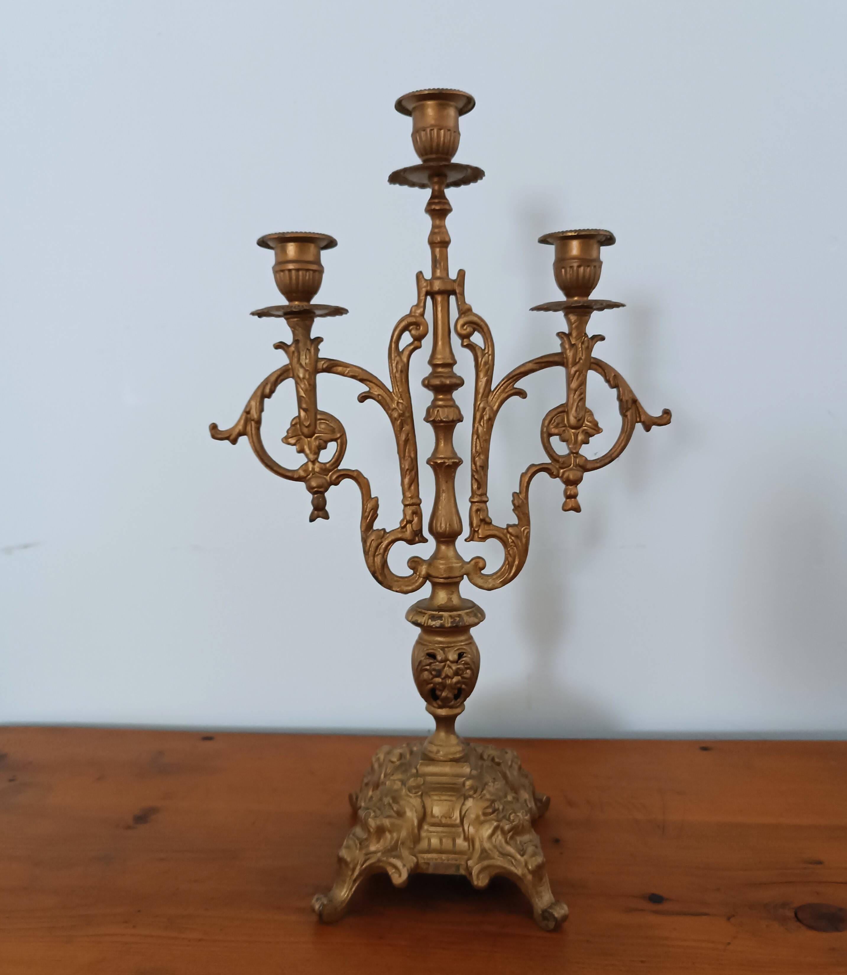 Bronze candlestick with lion head decoration