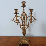 Bronze candlestick with lion head decoration