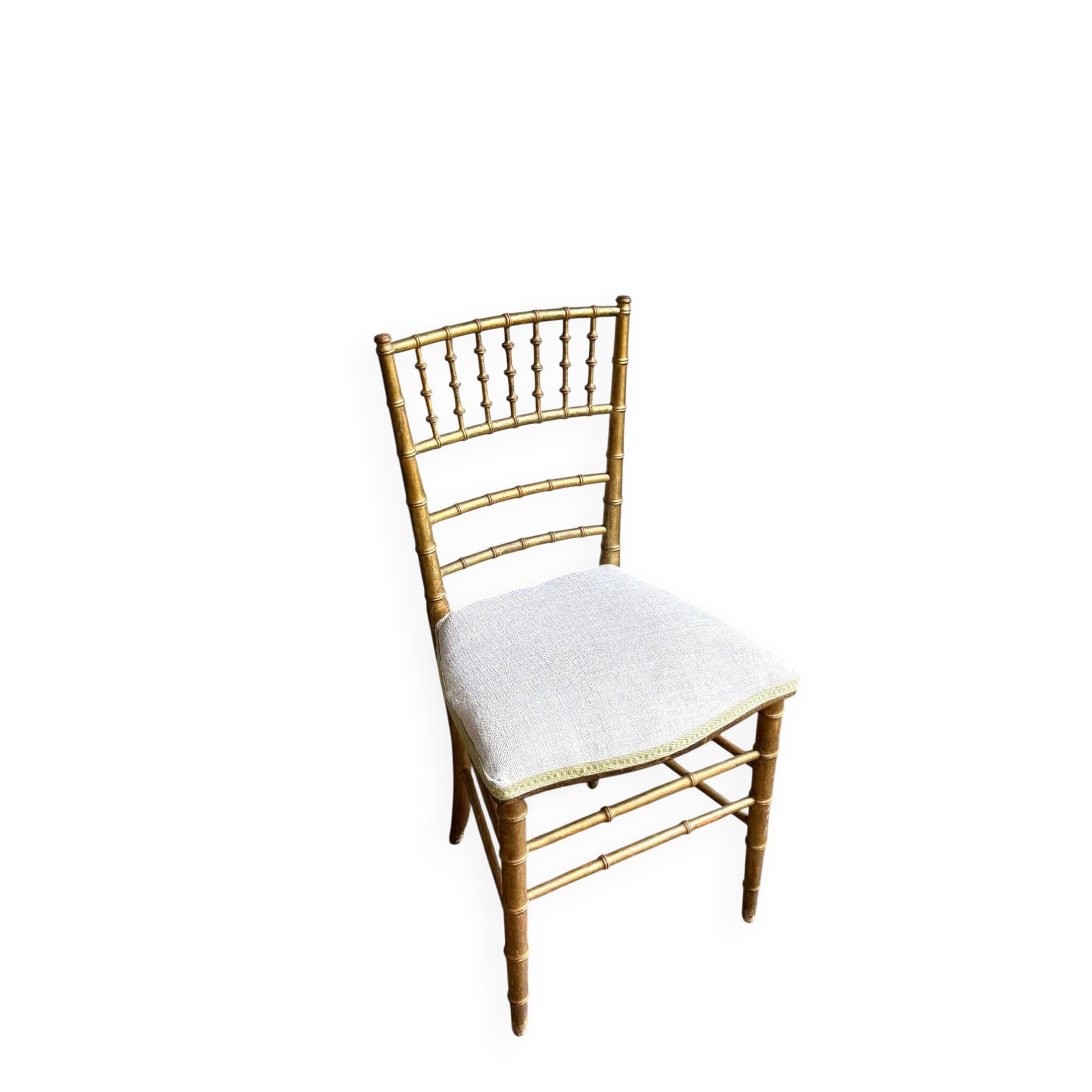 Napoleon III chair in gilded bamboo wood and beige cotton.