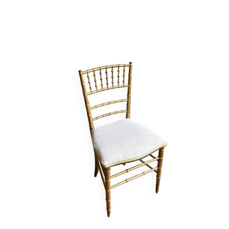 Napoleon III chair in gilded bamboo wood and beige cotton.