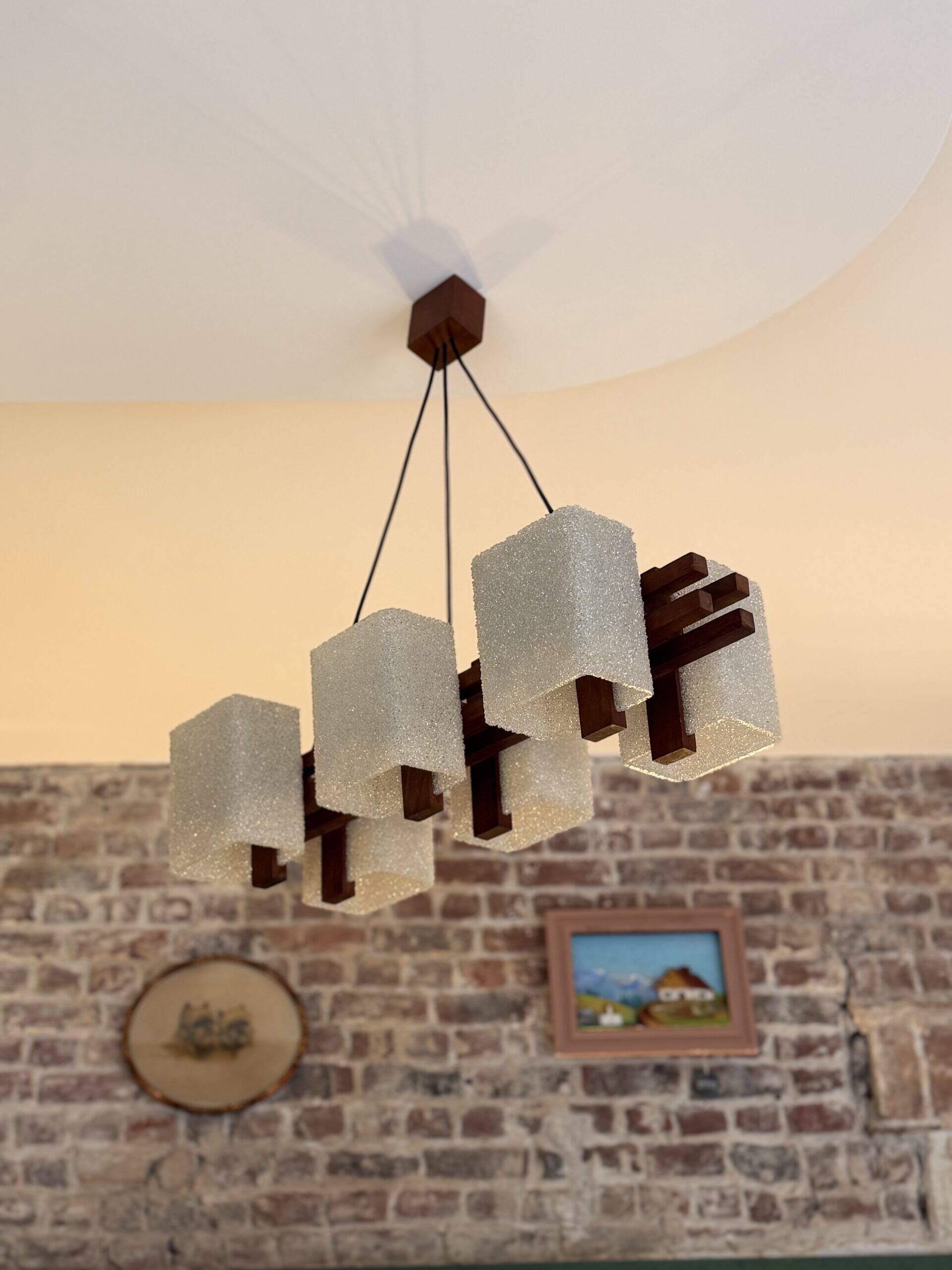 1960s Scandinavian suspension light in teak and perspex.