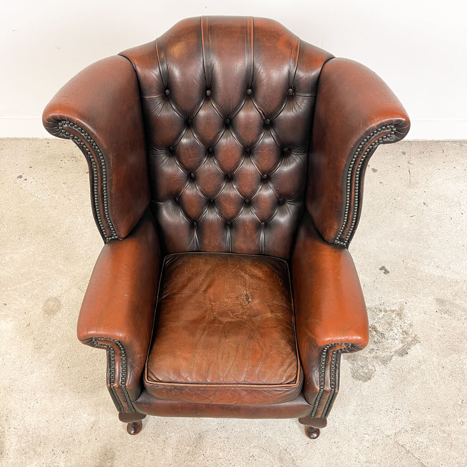 Vintage rustic dark brown leather chesterfield wingback armchair wassenaar