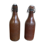 Set of 2 sandstone bottles with ceramic capsule