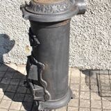 Poêle décoratif ancien en fonte noir Germare charbon bois