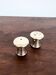 Mushroom-shaped salt and pepper shaker set in silver-plated metal.