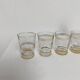 Liqueur carafe and its 4 small glasses