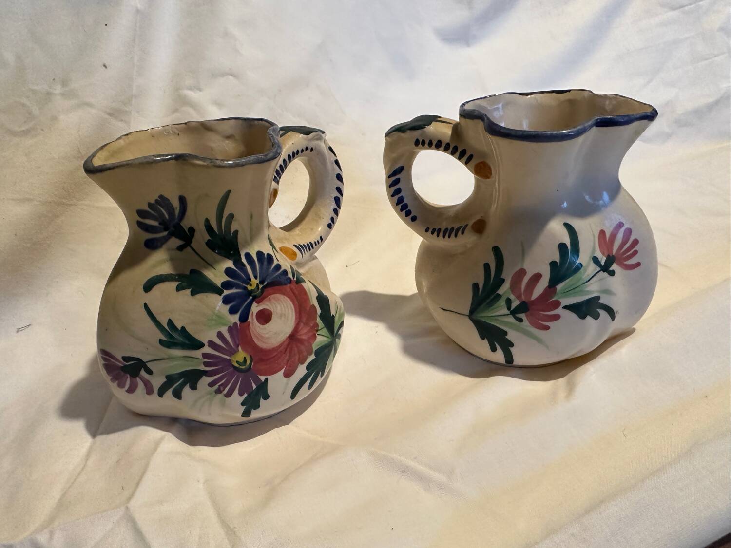 Pair of St Clement pitchers