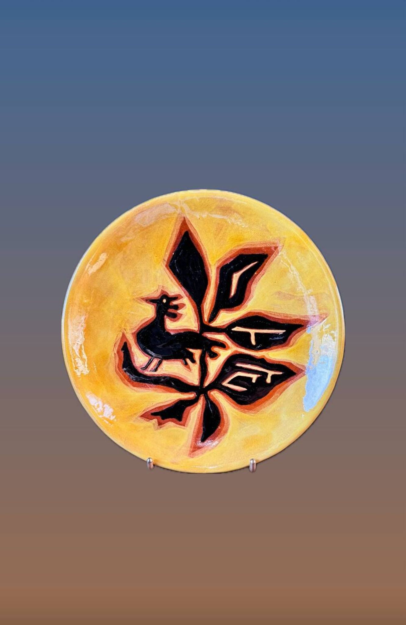 Terracotta plate, Jean Lurçat decorated with a rooster and foliage.