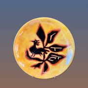 Terracotta plate, Jean Lurçat decorated with a rooster and foliage.
