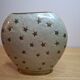 Small vintage soliflore vase in white enamelled brass with golden stars.