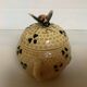 Old honey pot with bee decoration