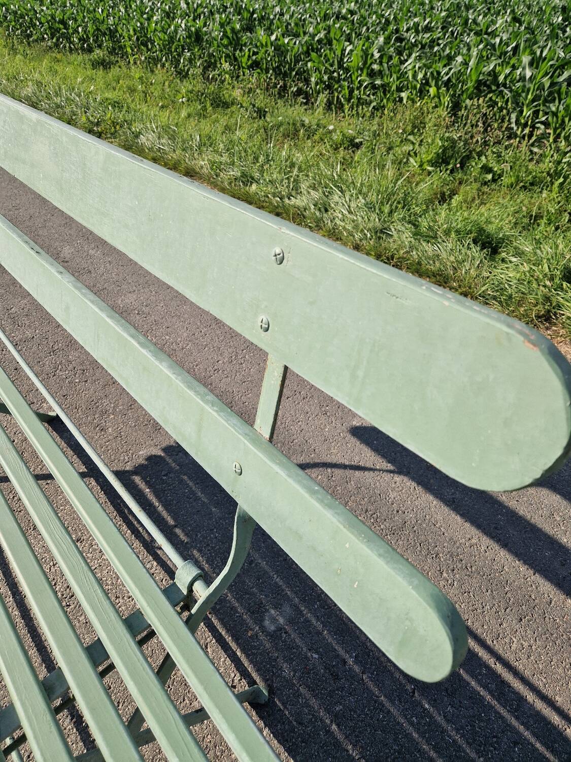 Ancien banc de jardin pliant en fer forgé vert