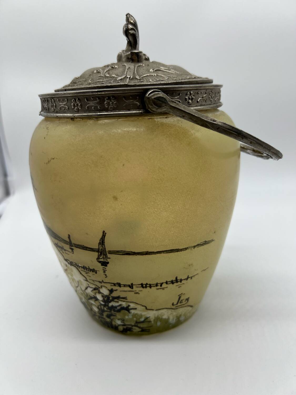 Old enameled glass cookie jar with mill decor